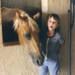 Little girls with Palomino Quarter Horse